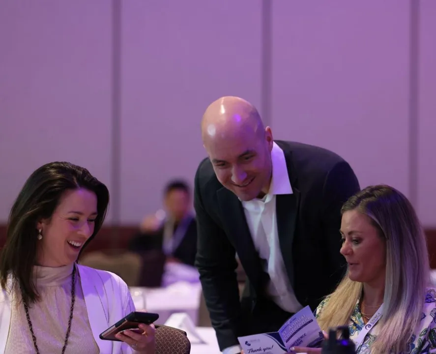 Conversation at a conference table during the OSWCA Annual Conference